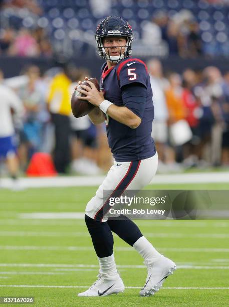 Brandon Weeden of the Houston Texans throws a pass during warm ups before playing the New England Patriots in a preseason game at NRG Stadium on...