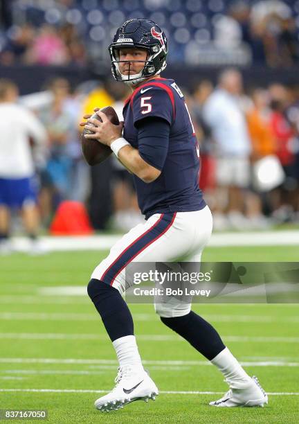 Brandon Weeden of the Houston Texans throws a pass during warm ups before playing the New England Patriots in a preseason game at NRG Stadium on...