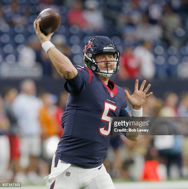 Brandon Weeden of the Houston Texans throws a pass during warm ups before playing the New England Patriots in a preseason game at NRG Stadium on...