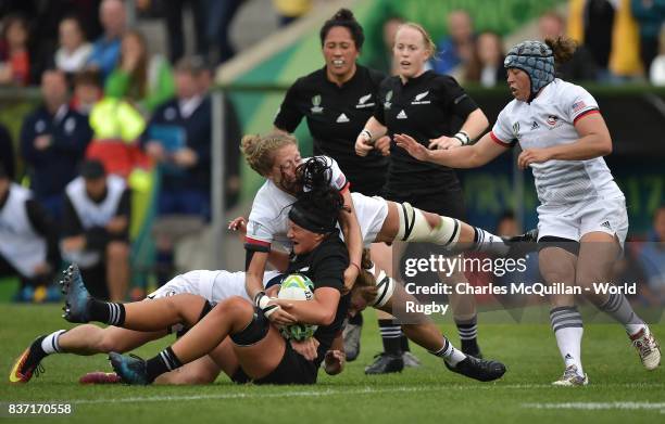 Charmaine Smith of New Zealand is tackled by Alev Kelter and Deven Owsiany of the United States during the Women's Rugby World Cup 2017 Semi Final...