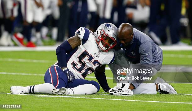 Elandon Roberts of the New England Patriots goes down with an injury against the Houston Texans in a preseason game at NRG Stadium on August 19, 2017...