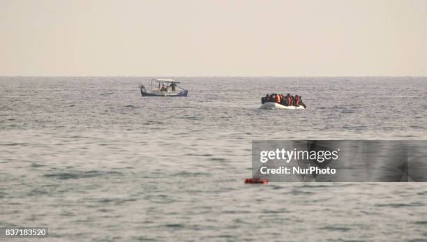 Refugees and migrants arriving at Lesvos island, Greece on March 12,2016. Refugees arriving at Lesvos in a rubber dinghy boat after they flee from...