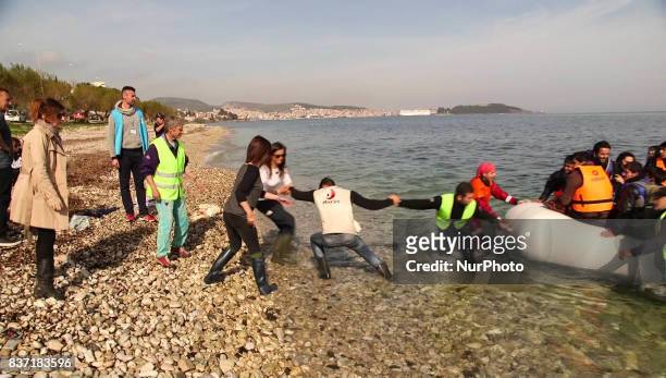 Refugees and migrants arriving at Lesvos island, Greece on March 12,2016. Refugees arriving at Lesvos in a rubber dinghy boat after they flee from...