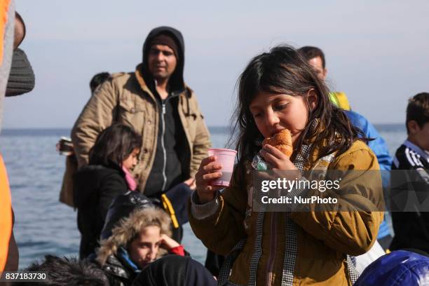 Refugees and migrants arriving at Lesvos island, Greece on March 12,2016. Refugees arriving at Lesvos in a rubber dinghy boat after they flee from...