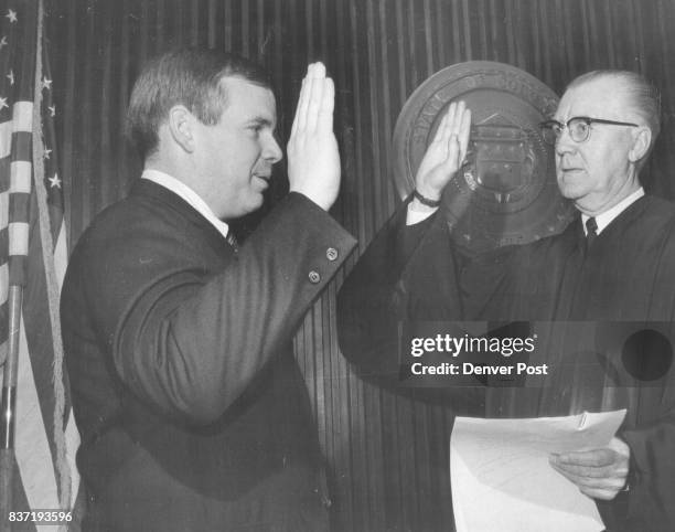 Newest Deputy DA Sworn in Robert J. Conrad left, was sworn in Friday as Denver deputy district attorney by Dist. Judge Gerald E. McAuliffe. Conrad...