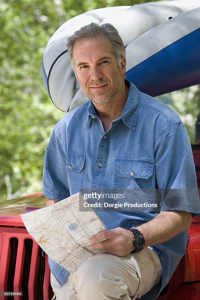 Portrait of an outdoors man with a map