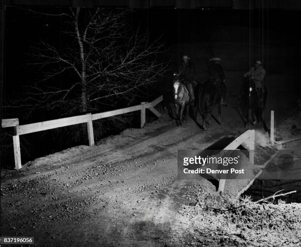 Three members of the Jefferson County Sheriff's Mounted Posse trade queries during their search for Adolph Coors III millionaire head of the Coors...