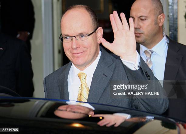 Prince Albert II de Monaco leaves the Red Cross headquarters in Monaco after giving parcels to Monaco's residents during an annual charity ceremony,...