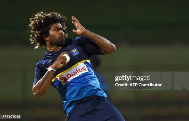 Sri Lanka's Lasith Malinga delivers the ball during a practice at the Pallekele International Cricket Stadium in Pallekele on August 22 ahead of the...