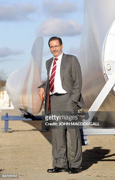 Brandenburg State Premier Matthias Platzeck poses next to giant blades used for wind farms as he visited the Vestas factory in Lauchhammer November...