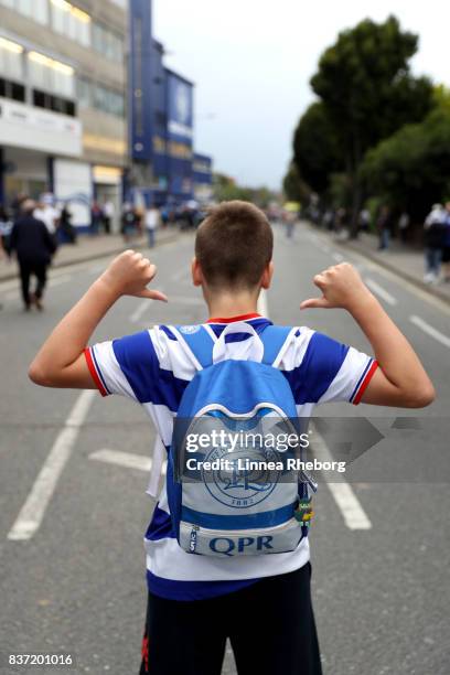 Fans arrive at the stadium before the Carabao Cup Second Round match between Queens Park Rangers and Brentford at Loftus Road on August 22, 2017 in...