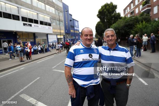 Fans arrive at the stadium before the Carabao Cup Second Round match between Queens Park Rangers and Brentford at Loftus Road on August 22, 2017 in...