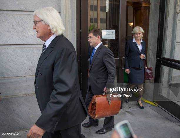 The members of Bill Cosbys legal team, Tom Mesereau, left, Sam Silver, center and Kathleen Bliss, right, leave the Montgomery County Courthouse after...