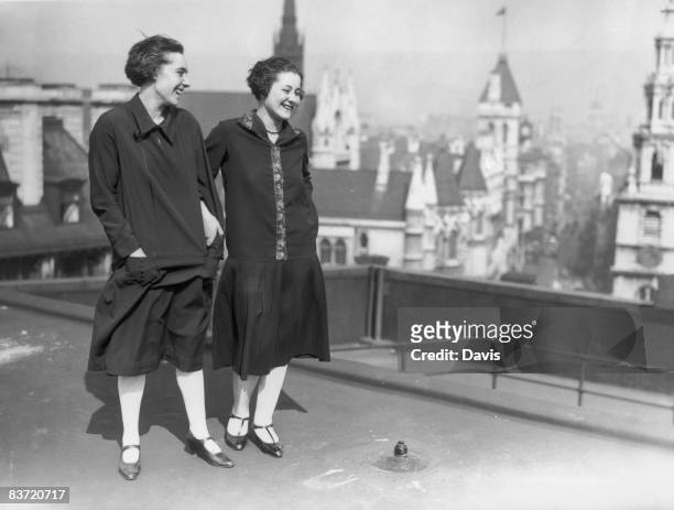 Two young ladies enjoy a cooling summer breeze on the roof of Australia House in London, 14th April 1926.