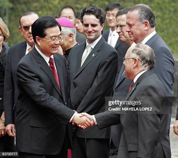 The President of China, Hu Jintao , shakes hands with the president of Costa Rica's National Congress, Francisco Antonio Pacheco , during a welcoming...