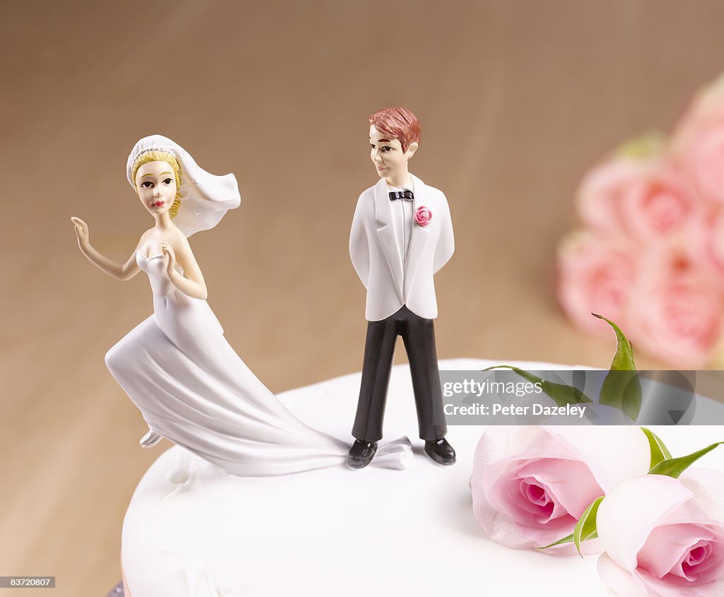 Escaping Bride on wedding cake