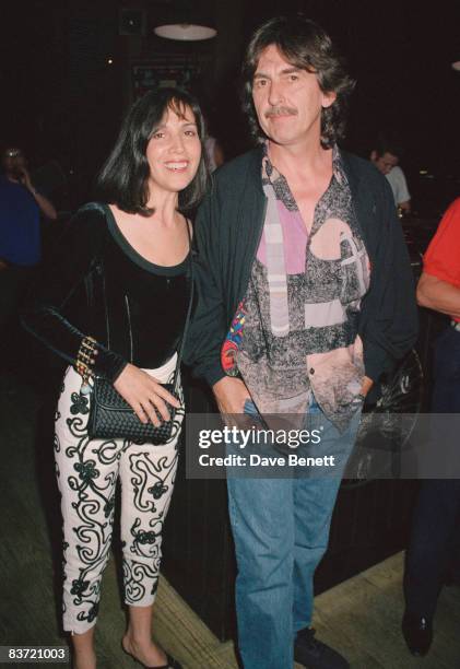 Former Beatle George Harrison and his wife Olivia attend the 21st birthday party of the Hard Rock Cafe in London, 15th June 1992.