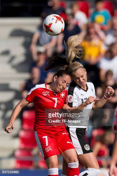 Martina Moser of Switzerland and Sarah Puntigam of Austria battle for the ball during the Group C match between Austria and Switzerland during the...