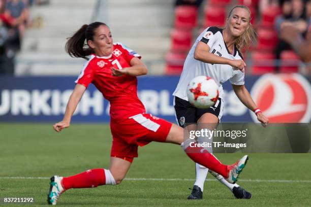 Martina Moser of Switzerland and Sarah Puntigam of Austria battle for the ball during the Group C match between Austria and Switzerland during the...