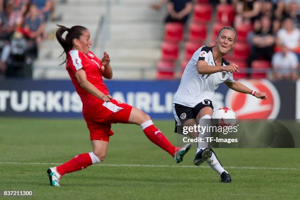 Martina Moser of Switzerland and Sarah Puntigam of Austria battle for the ball during the Group C match between Austria and Switzerland during the...