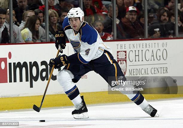 Eric Brewer of the St. Louis Blues takes the puck down the ice during a game against the Chicago Blackhawks on November 14, 2008 at the United Center...