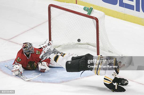 Blake Wheeler of the Boston Bruins scores a goal on goaltender Nikolai Khabibulin of the Chicago Blackhawks during the shootout at the United Center...