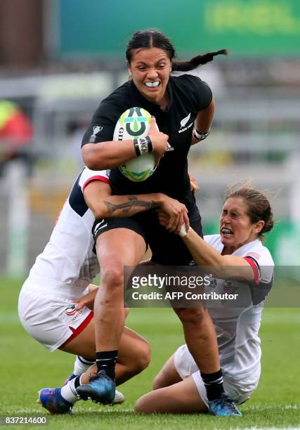 New Zealand's centre Stacey Waaka is tackled by US prop Tiffany Faaee and US fly-half Kimber Rozier during the Women's Rugby World Cup 2017...