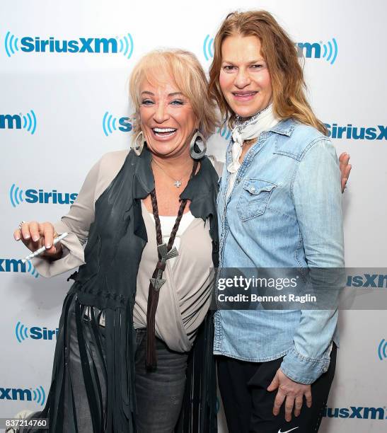 Recording artist Tanya Tucker and SiriusXM host Sandra Bernhard pose for a picture at SiriusXM Studios on August 22, 2017 in New York City.