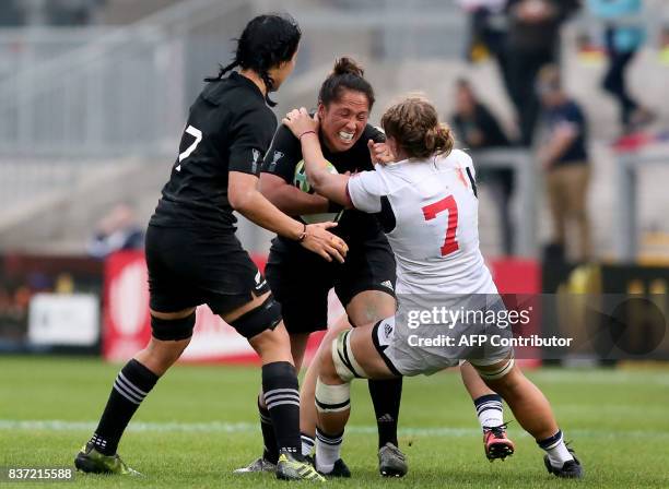 New Zealand's number 8 Aroha Savage is tackled by US flanker Kate Zachary during the Women's Rugby World Cup 2017 semi-final match between New...