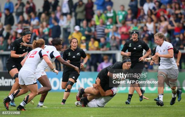 New Zealand's Aleisha Nelson is tackled during the Women's Rugby World Cup 2017 semi-final match between New Zealand and USA at The Kingspan Stadium...