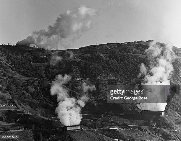 Steam billows from several turbine power plants that generates carbon and pollution free electrical energy in this 2008 Geyserville, California,...