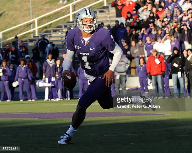 Quarterback Josh Freeman of the Kansas State Wildcats scrambles to the outside as he looks down field against the Nebraska Cornhuskers during the...