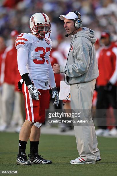Head coach Bo Pelini of the Nebraska Cornhuskers talks with safety Matt O'Hanlon during a time out against the Kansas State Wildcats in the third...