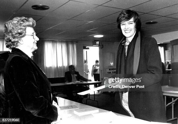 Rep Pat Schroeder gives ballot to election judge Bernice Scott, also her mother. Credit: The Denver Post