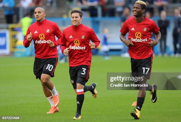 Wahbi Khazri, Bryan Oviedo and Didier N'Dong of Sunderland warm up during the Carabao Cup 2nd round match between Carlisle United and Sunderland at...