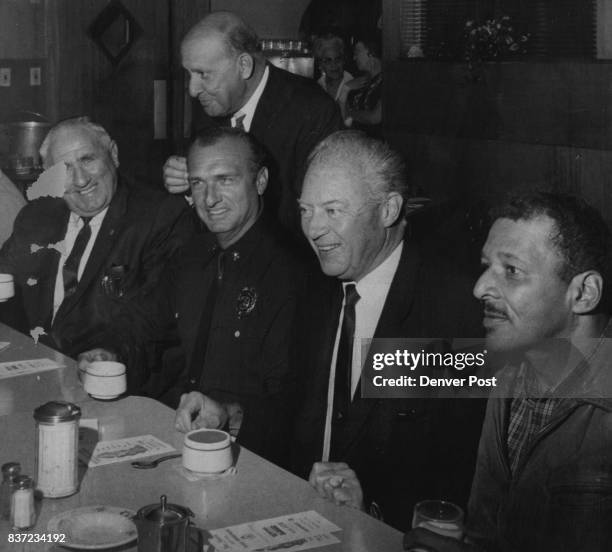 Candidate Steve McNichols, 2nd From Right, Confers at N. Denver Meeting They are, seated from left, Austin J. Gibbons, chairman of the police...