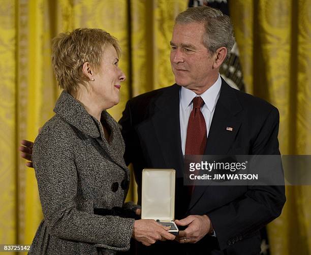 President George W. Bush presents the Presidential Citizens Medal to Chairman of the President�s Committee on the Arts and the Humanities Adair Margo...
