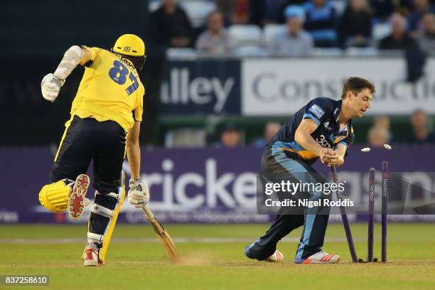 Matt Henry of Derbyshire Falcons takes the wicket of Kyle Abbott of Hampshire during the NatWest T20 Blast at The 3aaa County Ground on August 22,...