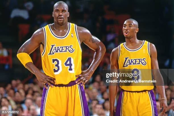 Shaquille O'Neal and Kobe Bryant of the Los Angeles Lakers look on against the Utah Jazz on November 20, 1996 at the Great Western Forum in...