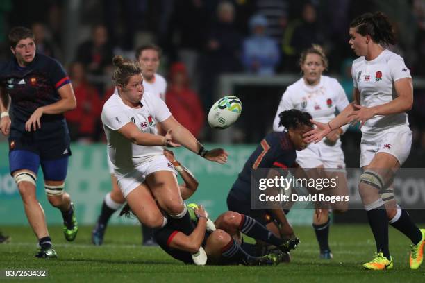 Marlie Packer of England offloads to Sarah Hunter of England during the Women's Rugby World Cup 2017 Semi Final match between England and France at...