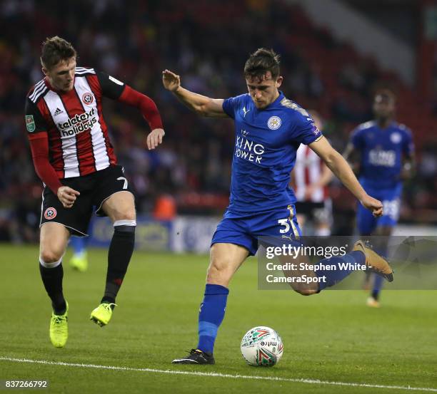 Leicester City's Ben Chilwell shoots past Sheffield United's John Lundstram during the Carabao Cup Second Round match between Sheffield United and...