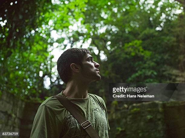 man exploring in jungle, looking up - san luis potosi ストックフォトと画像