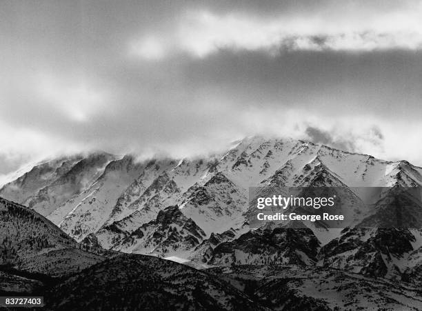 California's Eastern High Sierra mountains are covered with a heavy snowfall viewed in this 1990 Bishop, California, winter landscape photo.