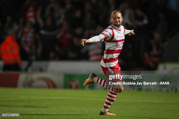 Alfie May of Doncaster Rovers celebrates after scoring a goal to make it 1-0 during the Carabao Cup Second Round match between Doncaster Rovers and...