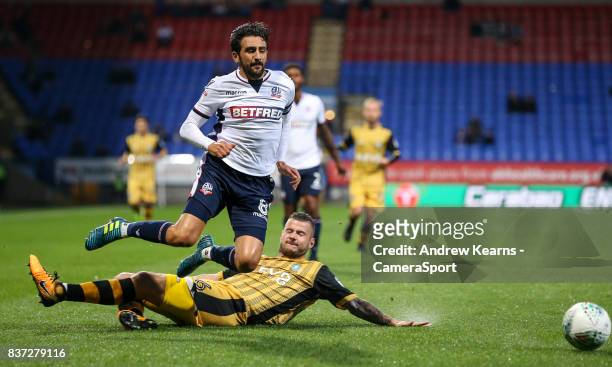 Bolton Wanderers' Jem Karacan is brought down by Sheffield Wednesday's Daniel Pudil during the Carabao Cup Second Round match between Bolton...