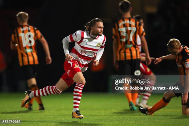 Alfie May of Doncaster Rovers celebrates after scoring a goal to make it 1-0 during the Carabao Cup Second Round match between Doncaster Rovers and...