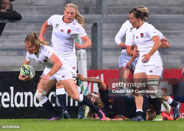 England's Lydia Thompson clears the ball from France's Lenaig Corson during the Women's Rugby World Cup 2017 semi-final match between England and...