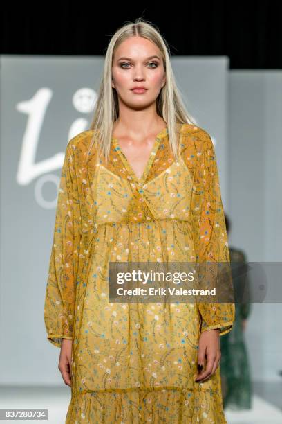 Model walks the runway at the Line Of Oslo show during the Fashion Week Oslo Spring/Summer 2018 on August 22, 2017 in Oslo, Norway.