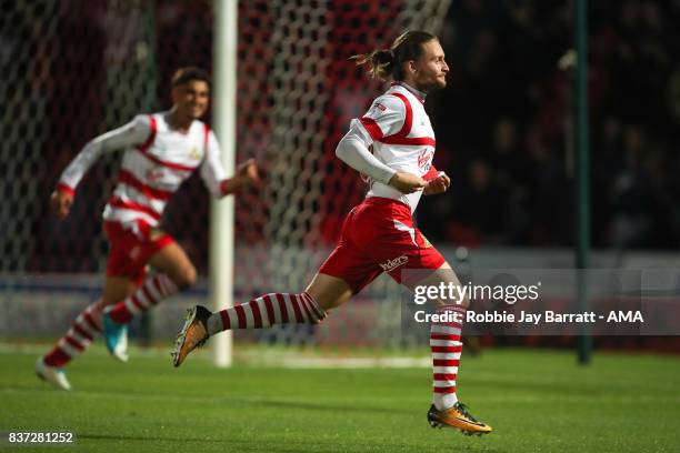 Alfie May of Doncaster Rovers celebrates after scoring a goal to make it 1-0 during the Carabao Cup Second Round match between Doncaster Rovers and...