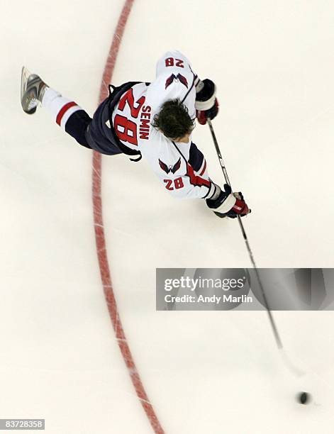 Alexander Semin of the Washington Capitals fires a shot during warmups prior to the game against the New Jersey Devils at the Prudential Center on...